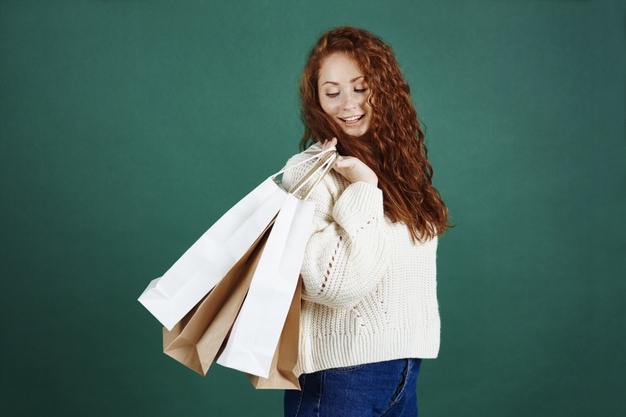happy-girl-with-shopping-bags-studio-shot_329181-7358